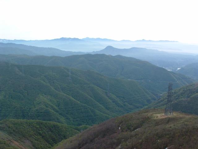 The mountains of Nikko and Mt. Joushu-Hotaka from the Mt. Inatsutsumi mountaintop.